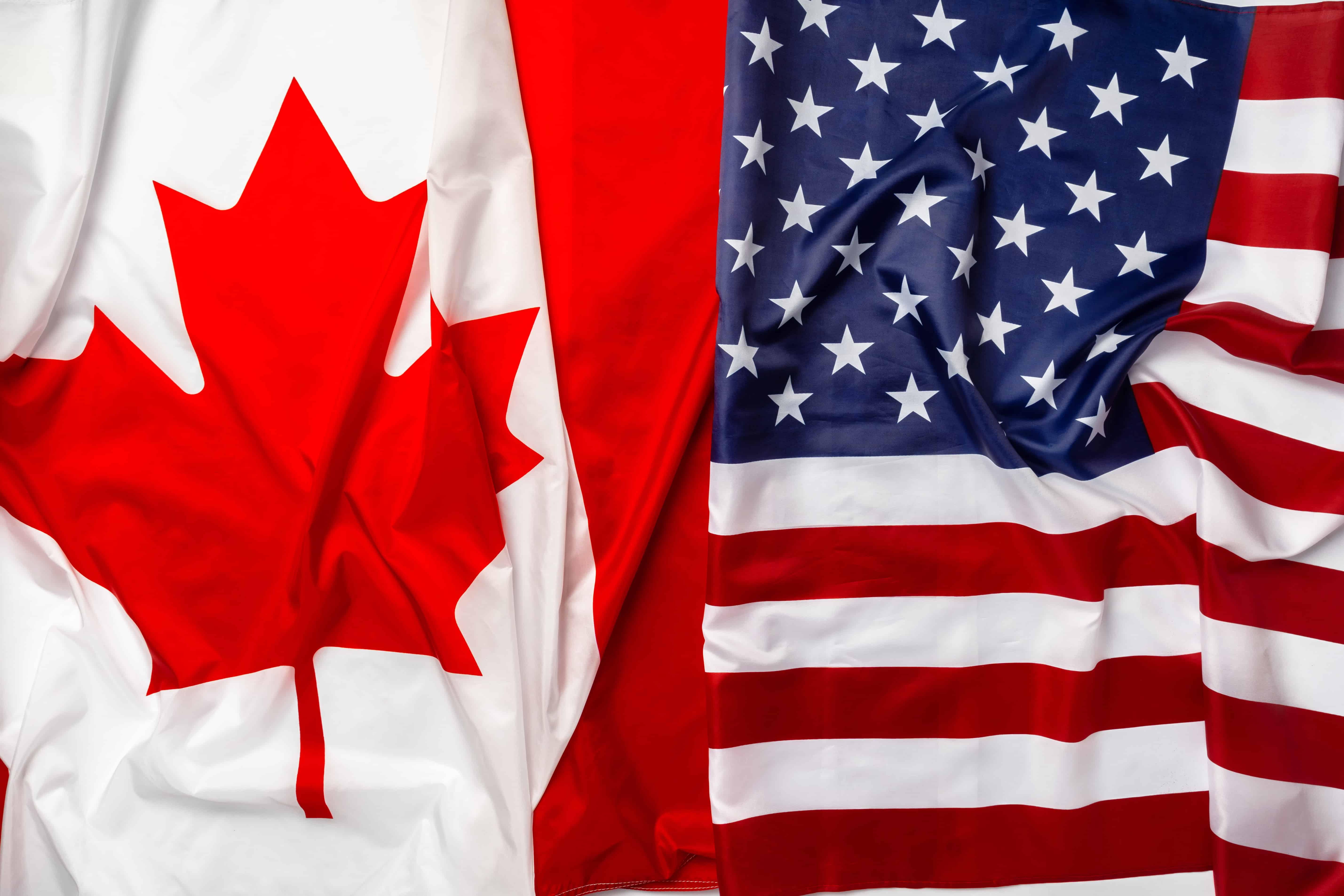 flags of canada and usa folded together