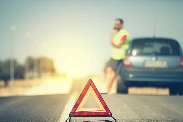 a warning sign on a road 